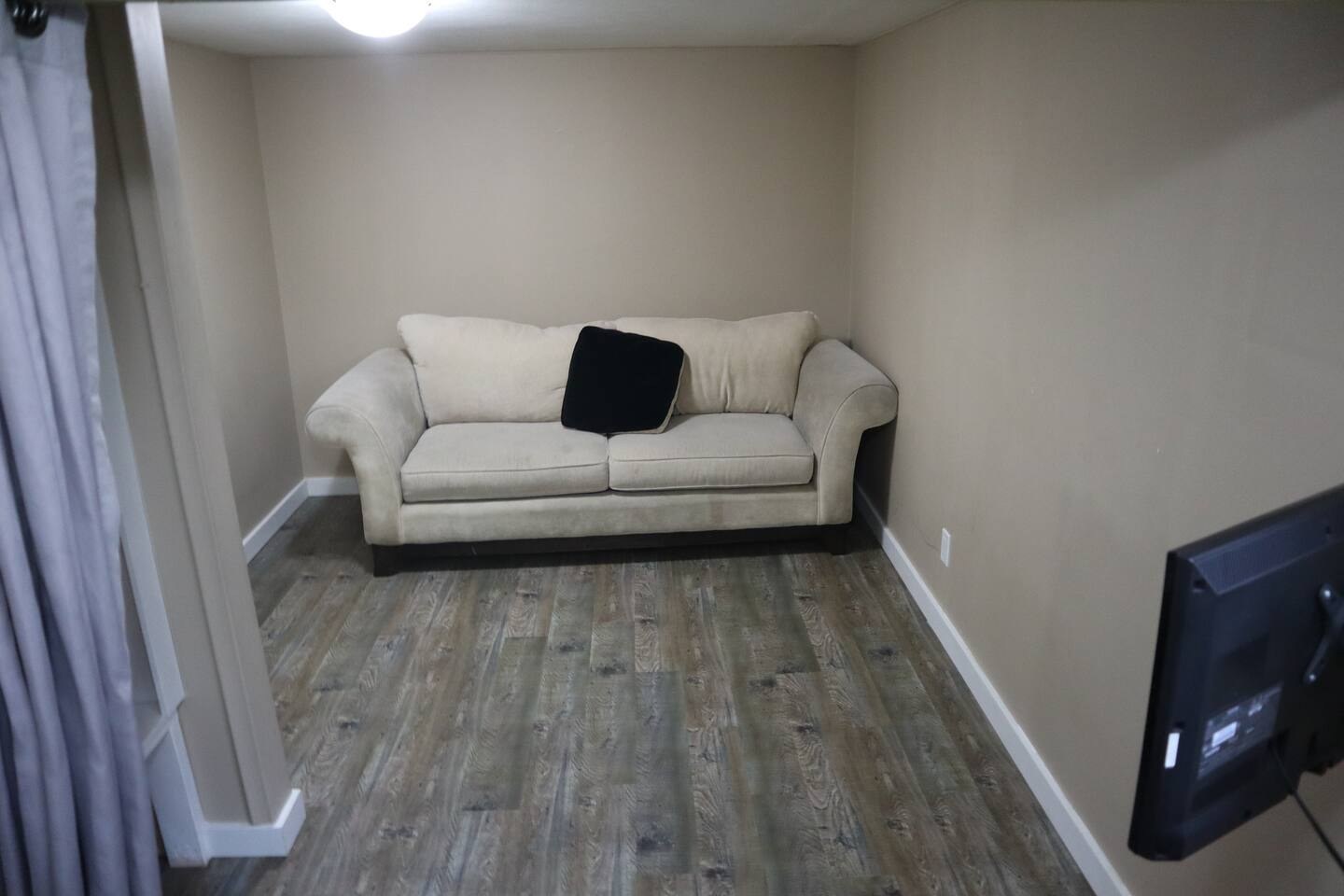 Living room at the furnished basement suite